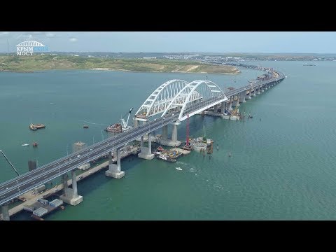 Когда открытие крымского моста через керченский пролив в 2018 году для легковых и грузовых автомобилей и когда откроют железнодорожное движение для поездов